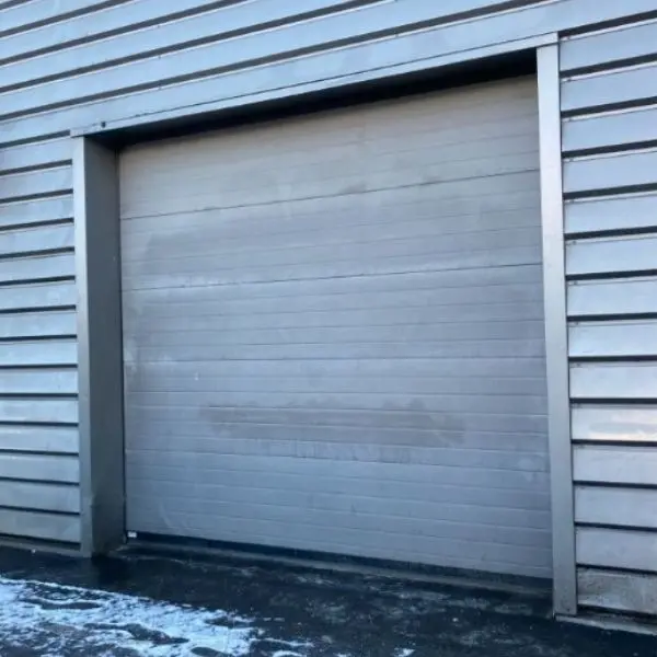 Réparation porte garage sectionnelle à Brie Comte Robert