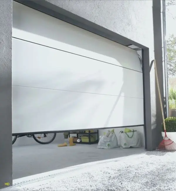 Réparation porte de garage sectionnelle à Vaux le Pénil