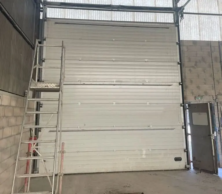 Réparation porte sectionnelle à Malakoff