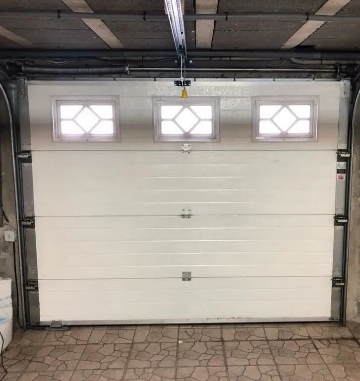 Réparation porte sectionnelle à Frépillon