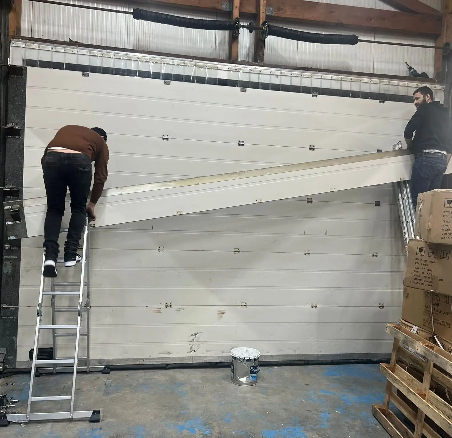 Réparation porte sectionnelle à Ennery