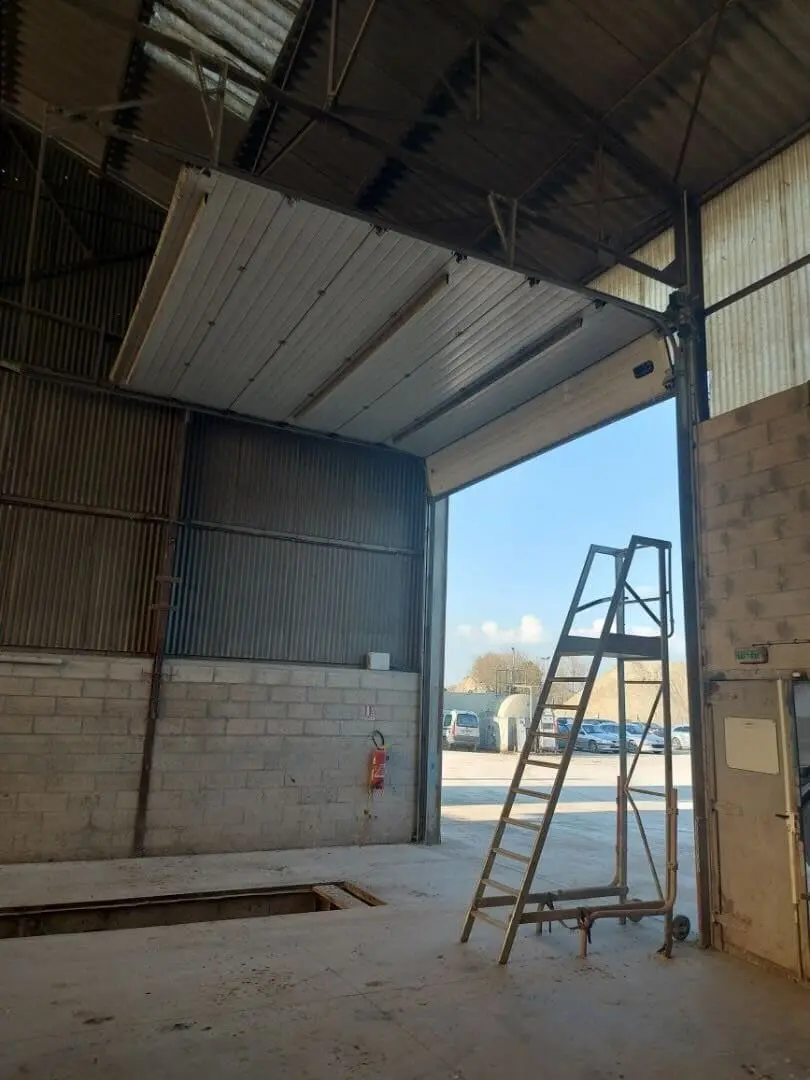 Réparateur de Porte Sectionnelle Deuil la Barre