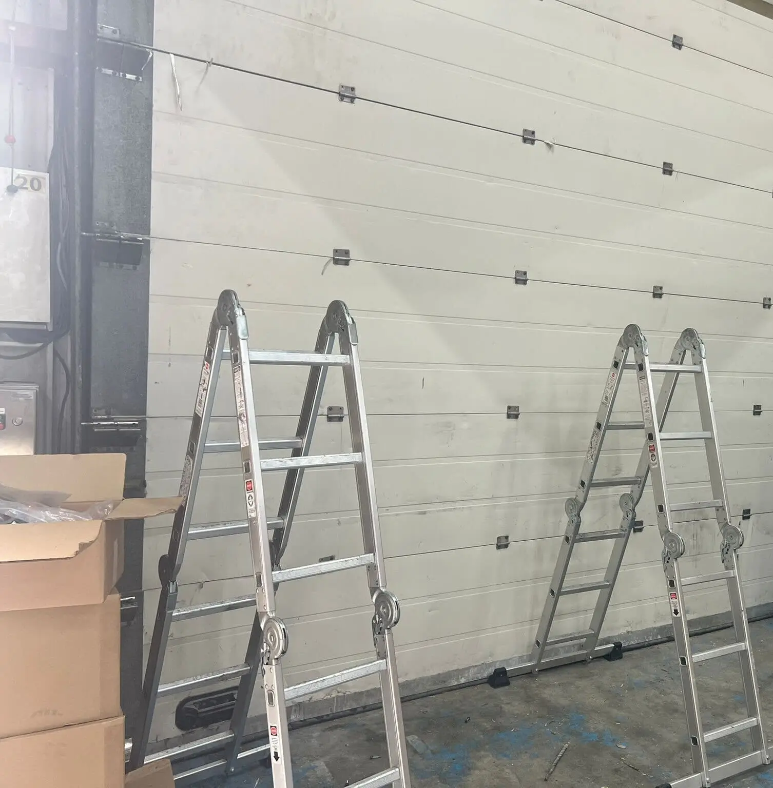 Réparation porte sectionnelle à Louvres (95380)