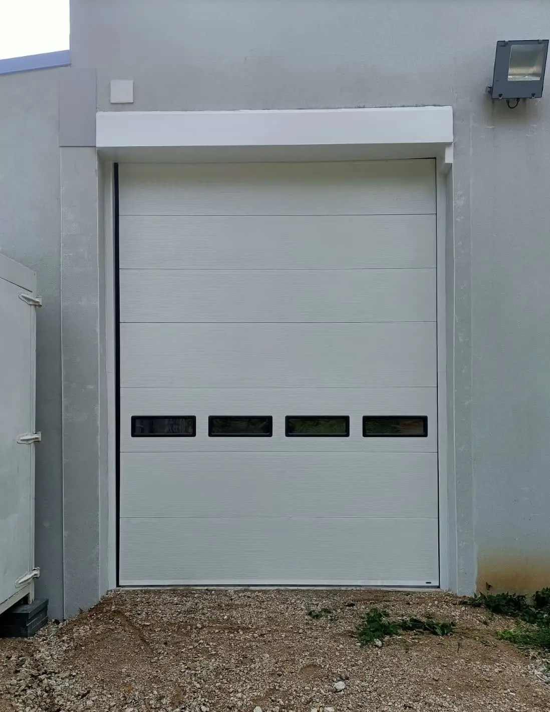 Pose porte sectionnelle industrielle à Paris