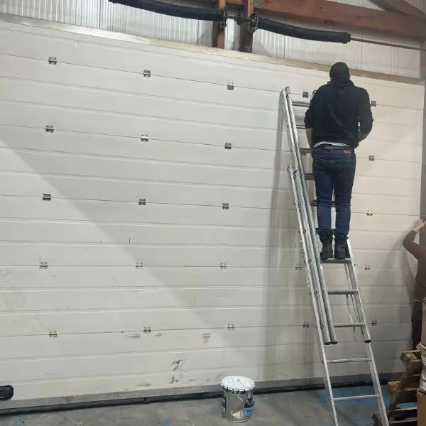 Réparation porte sectionnelle industrielle Saint Mandé