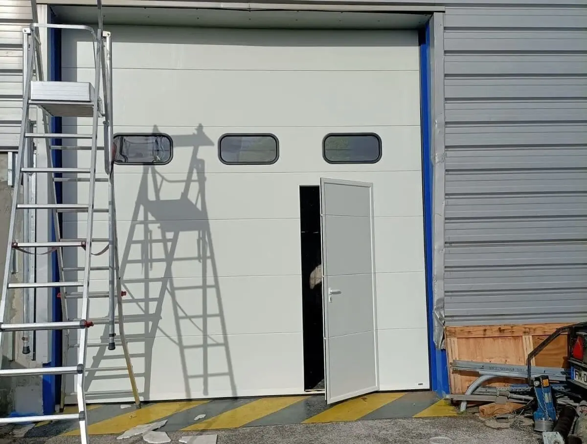 Réglage câble porte de garage sectionnelle