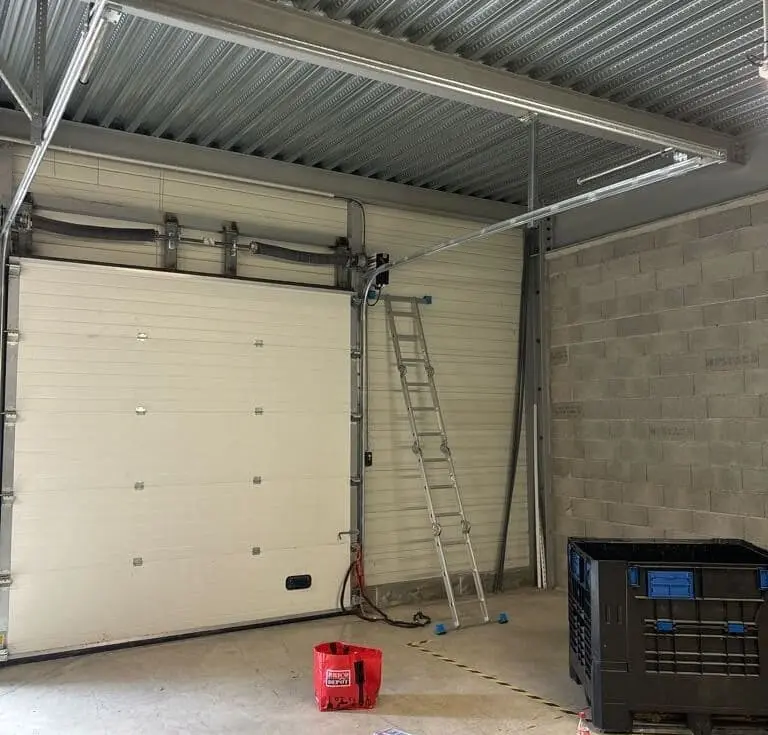 réparation porte sectionnelle Dammarie-les-Lys